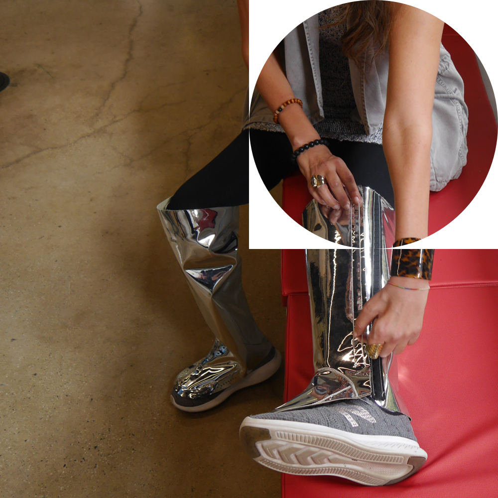 Close up of the leg brace cover made out of a reflective silver material.