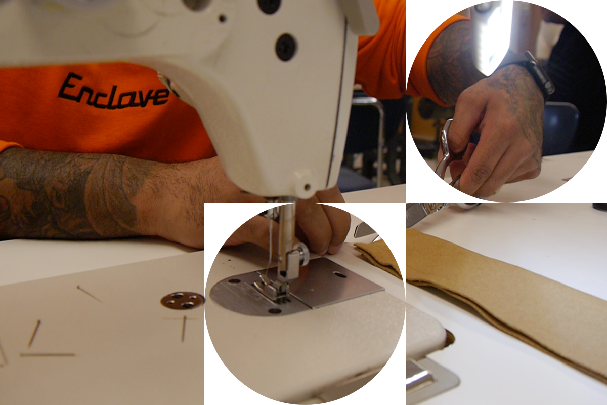 Closeup photo of sewing machine. In the background a person is cutting fabric with scissors.